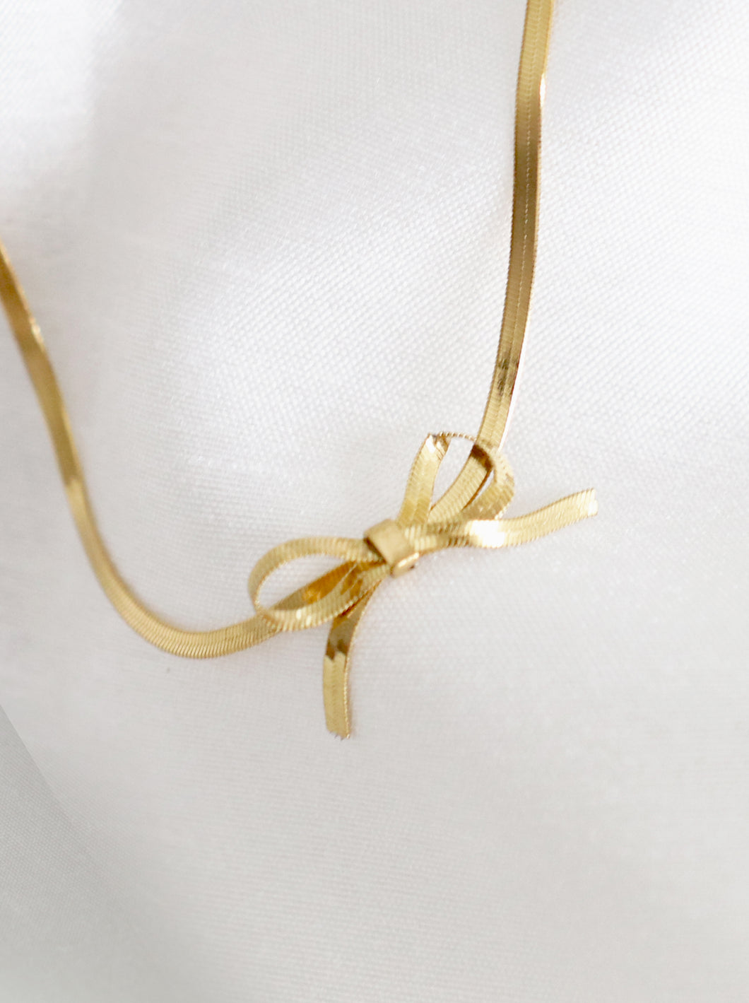 Gold Tone Herringbone Bow Necklace