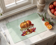 Load image into Gallery viewer, Pumpkin on ornate gold cake stand surrounded by autumn leaves, 11x15 inch tempered glass cutting board Halloween decor, thanksgiving decorations
