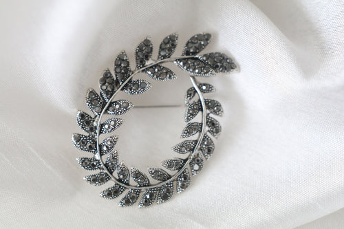 Silver leaf wreath brooch with sparkling stones, 2 1/8 x 1 1/2 inch vintage inspired jewelry pin for women.