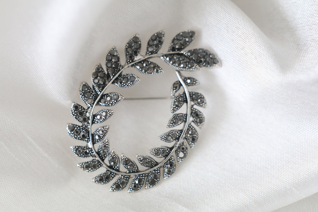 Silver leaf wreath brooch with sparkling stones, 2 1/8 x 1 1/2 inch vintage inspired jewelry pin for women.